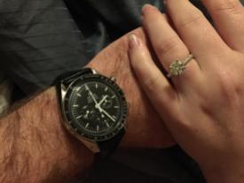 Taken around 2am right after the proposal. My engagement ring and his engagement watch.